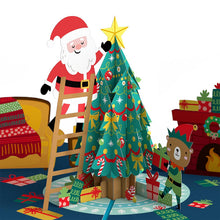 Load image into Gallery viewer, Santa Decorating a Christmas Tree Lovepop Card
