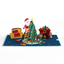 Load image into Gallery viewer, Santa Decorating a Christmas Tree Lovepop Card
